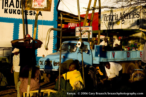 Men wait for work and variously hang out along highway, Katarina