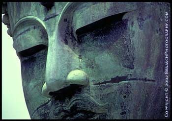 Buddhism. The great Diabutsu of Kamakura, Japan, large bronze statue of sitting Buddha, detail of face. Japanese tourism. Religions