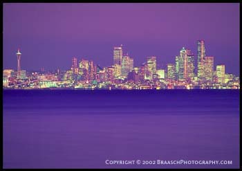 Seattle Washington from Bainbridge Island, dusk. Photographed in 1996. Cities. Night. Light. Skyscrapers. Puget Sound. Washington State. Cityscapes