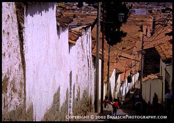 View down steep street into Cusco, Peru. Andes Highlands. Inca culture. Cities. travel photography. Streets