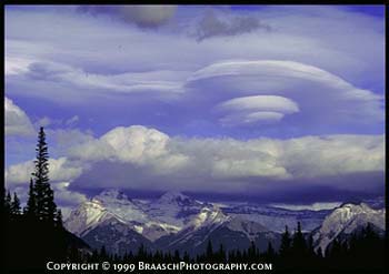 Clouds. Series of lenticular clouds describes waves of air flowing over Canadian Rockies in Banff National Park. Turbulence. Weather