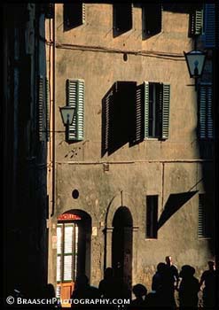 Siena. italy. Tuscany. Architecture. Street scene. Shutters. Sunlight. Shadows